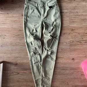 Green skinny jeans with rips from American Eagle